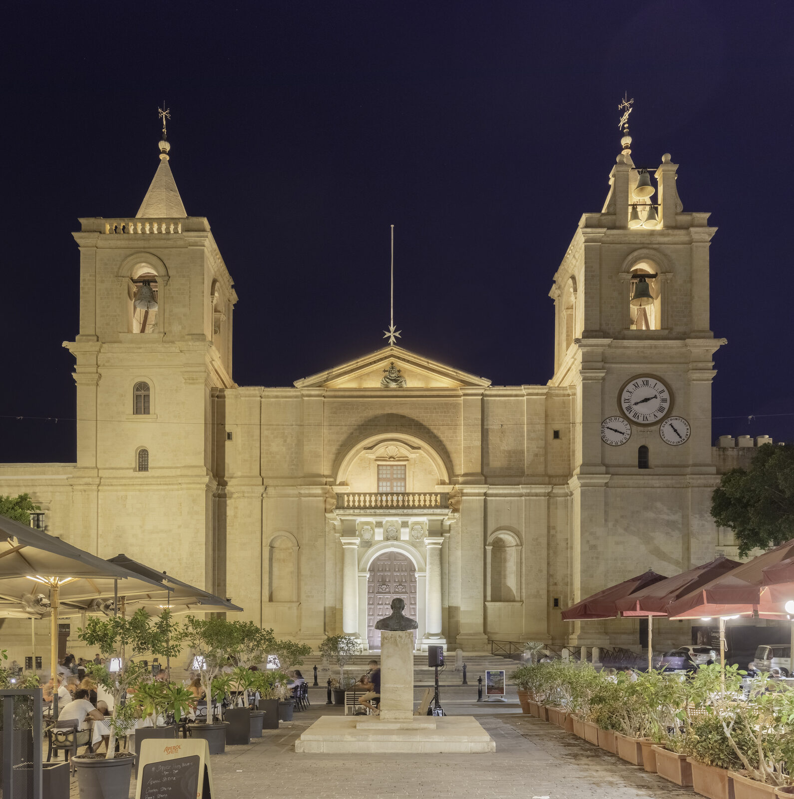 St John's Co-Cathedral, Valletta, illuminated at night with its twin bell towers and clock