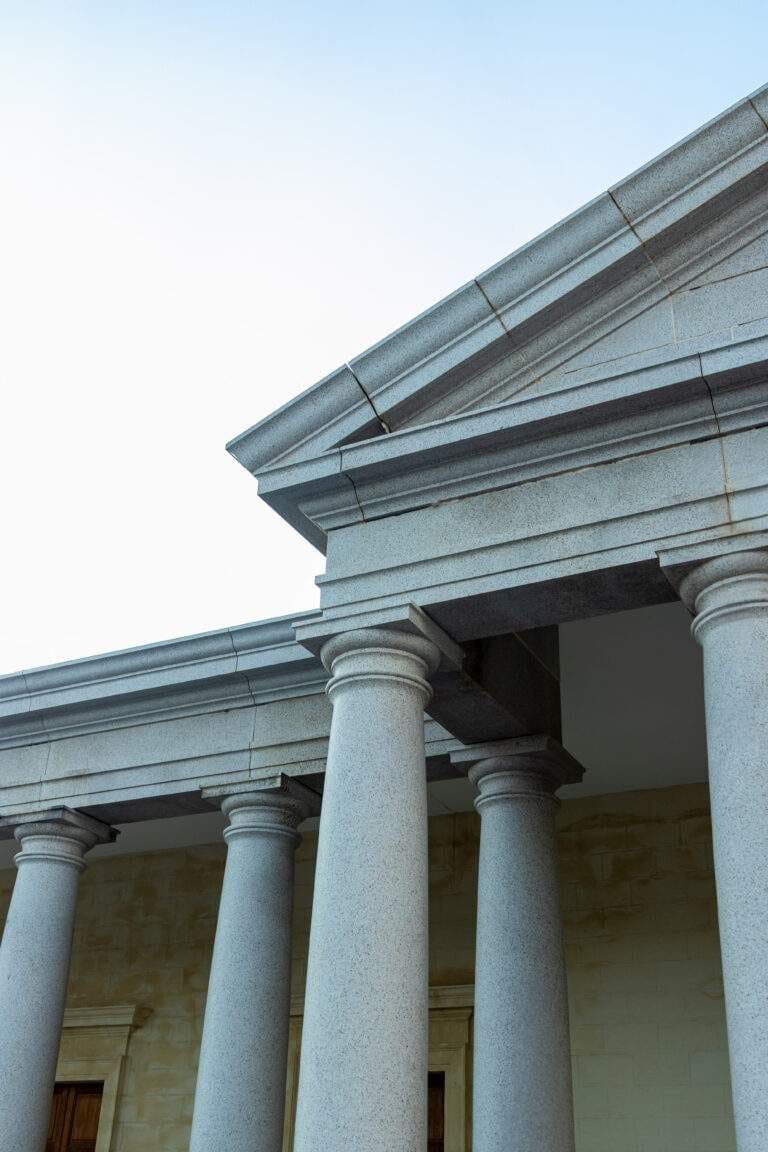 Stone columns and a pediment on a classical building at the estate