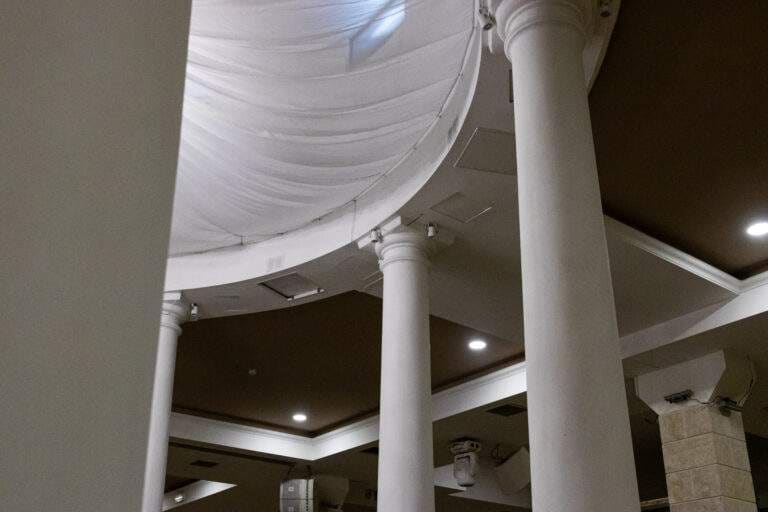 White draped ceiling and columns inside an event space