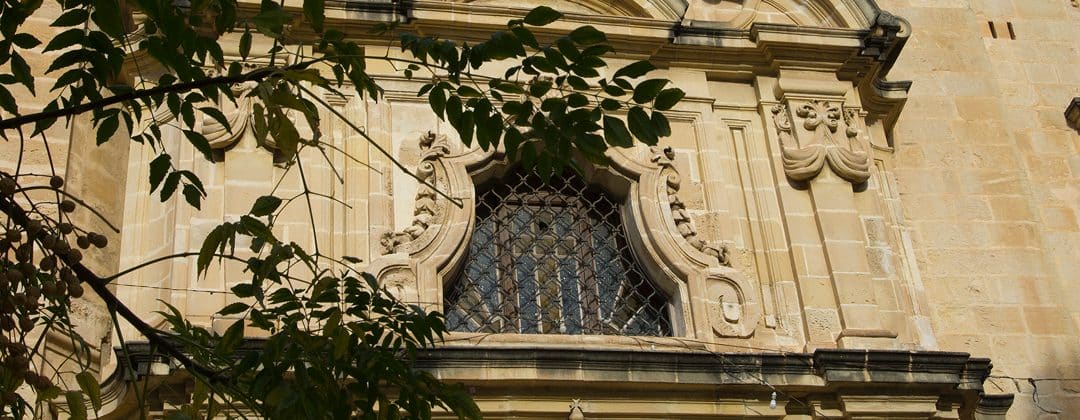 Carved stone window on the chapel facade