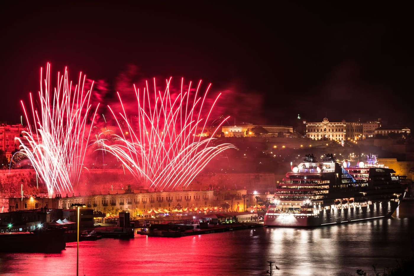 Fireworks over the Grand Harbour with a cruise ship in the foreground
