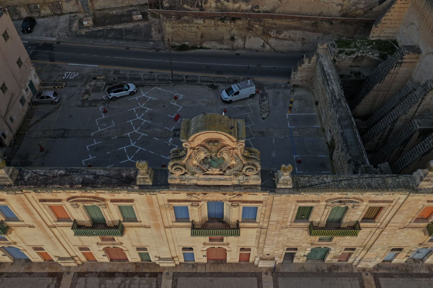 An aerial view of the waterfront car park and ornate facade below