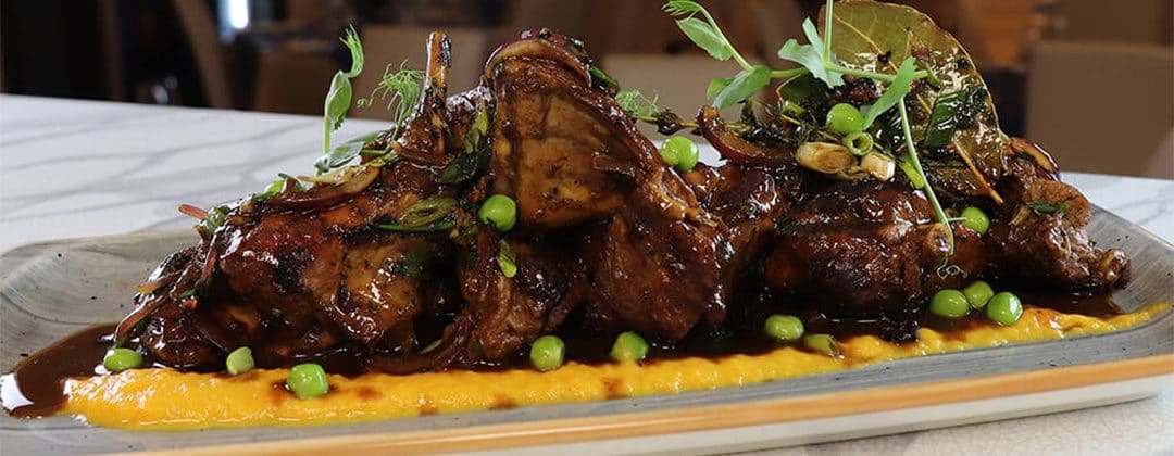 Slow-cooked meat with peas on a bed of purée at Ta' Detta