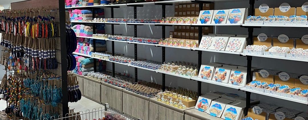 Shelves of colourful gifts and souvenirs inside a waterfront shop