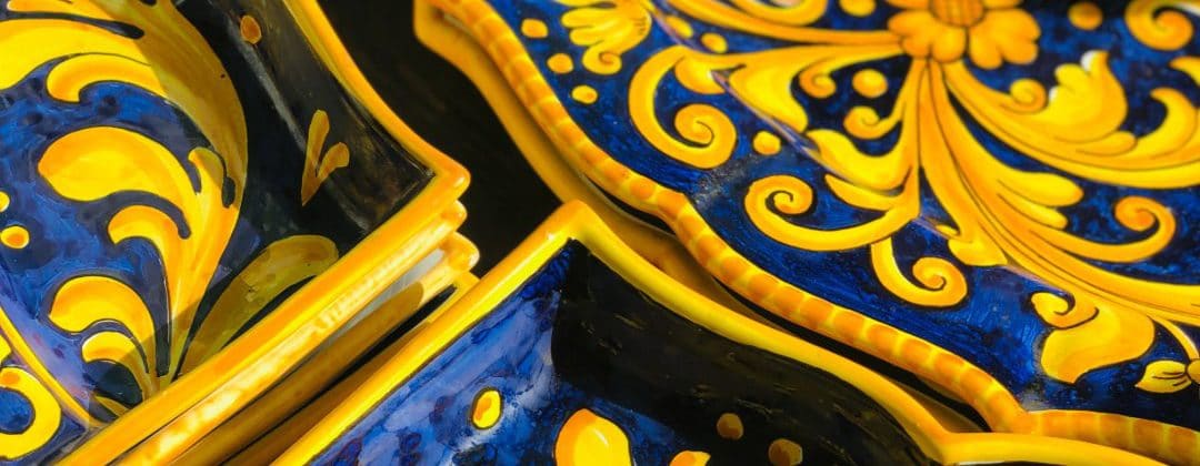 Close-up of hand-painted Maltese ceramic in blue and yellow